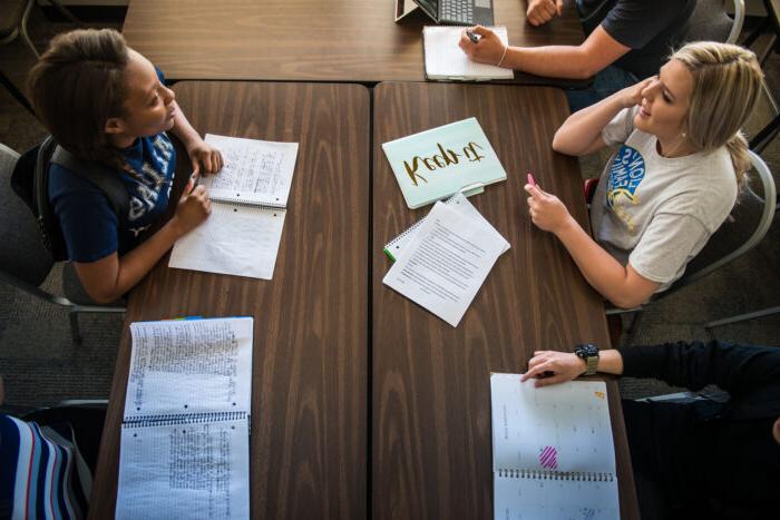 Students studying and having a conversation.