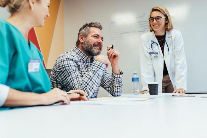 Medical team interacting at a meeting in boardroom.